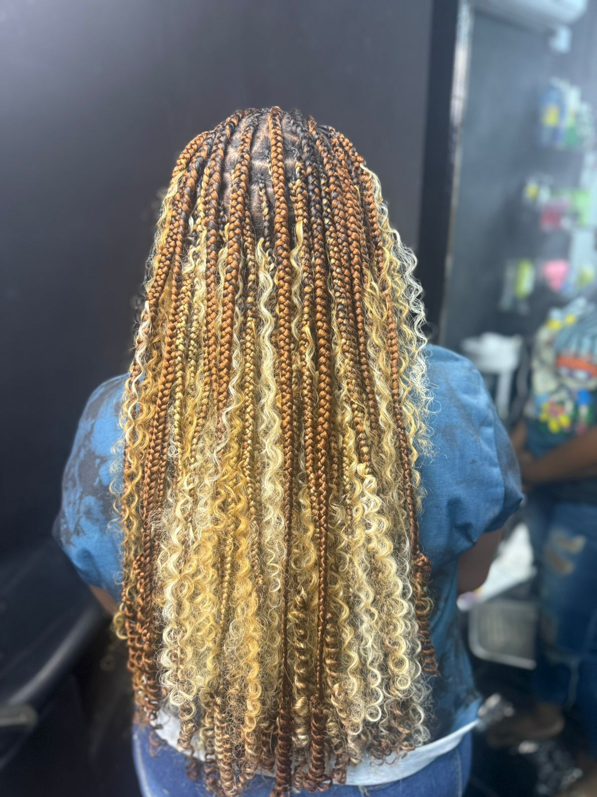 Blonde and brown boho braids shown from the back